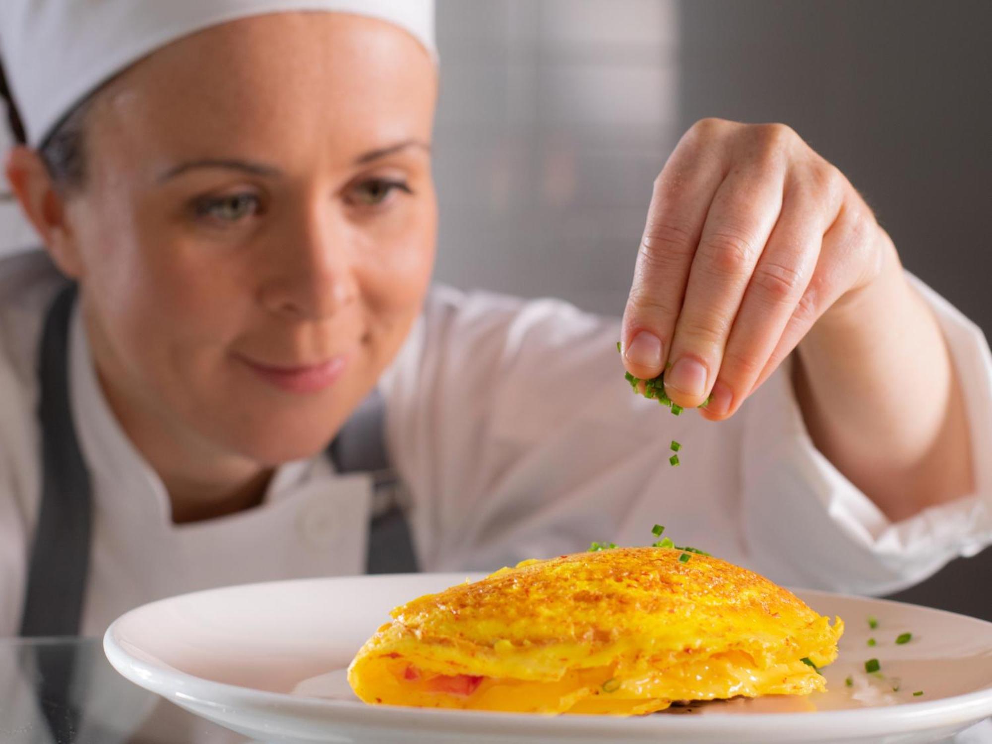 Otl Gouverneur Sherbrooke Exteriör bild A chef seasoning a dish